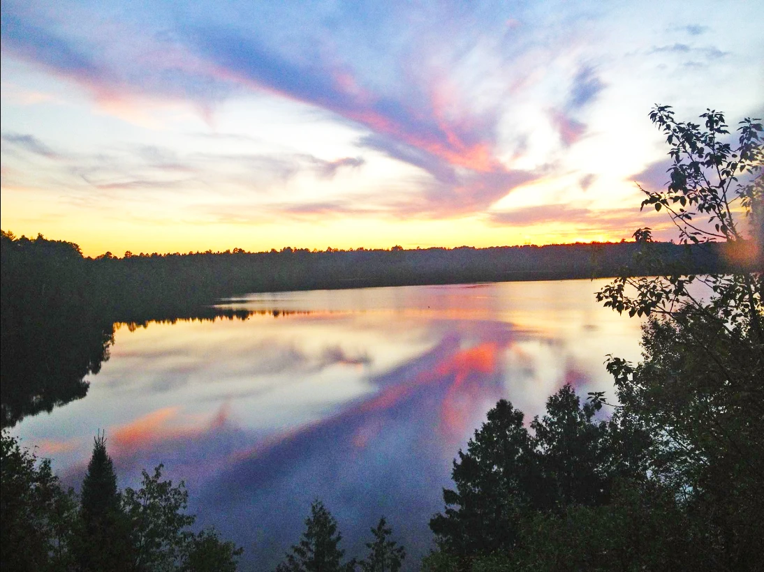 Sunset reflecting on a northern Michigan forest river, photographed by the U.S. Forest Service